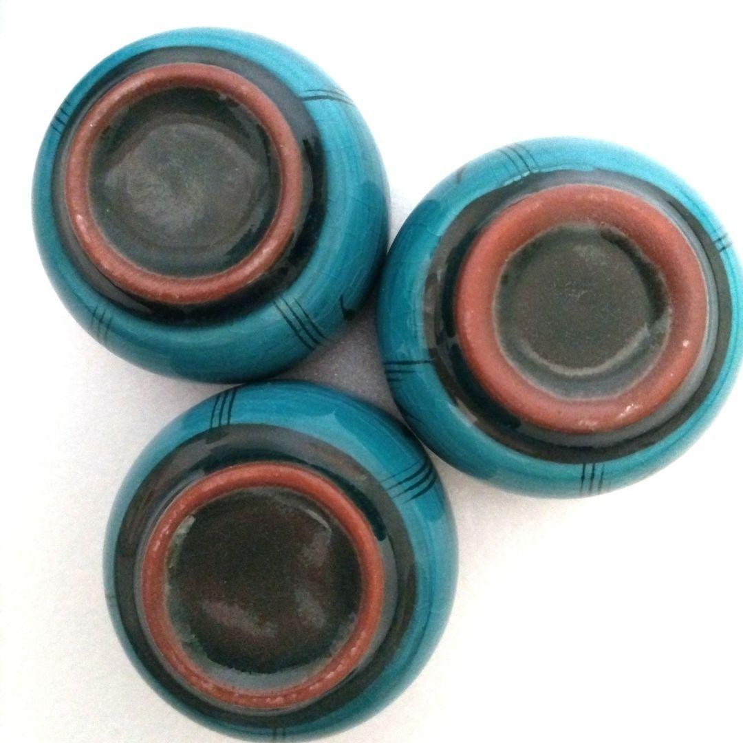 Turquoise blue ceramic sake set. One sake bottle, three tea cups.