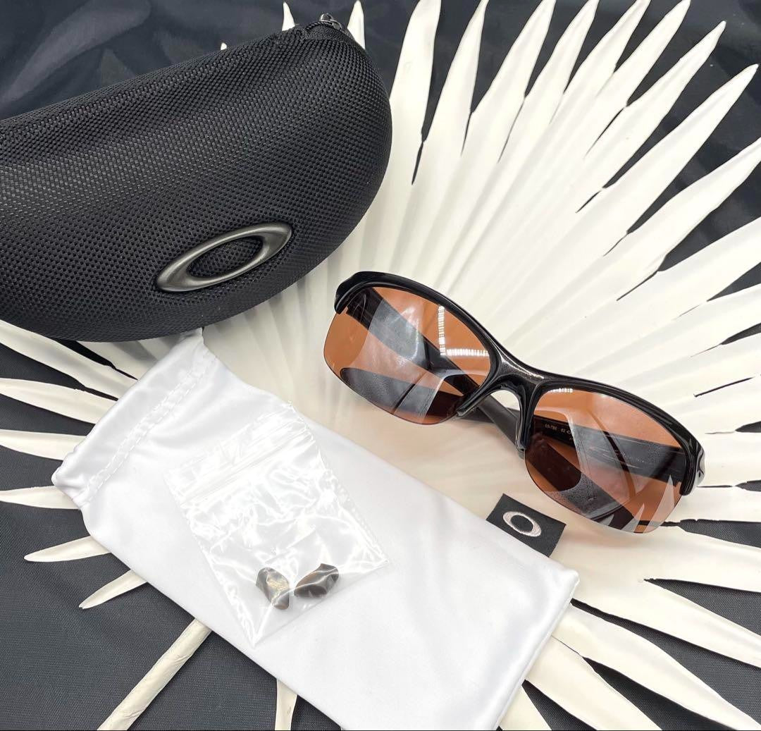 Oakley Commit Sunglasses 03-786 62/12 124 Black Frame Brown Lenses