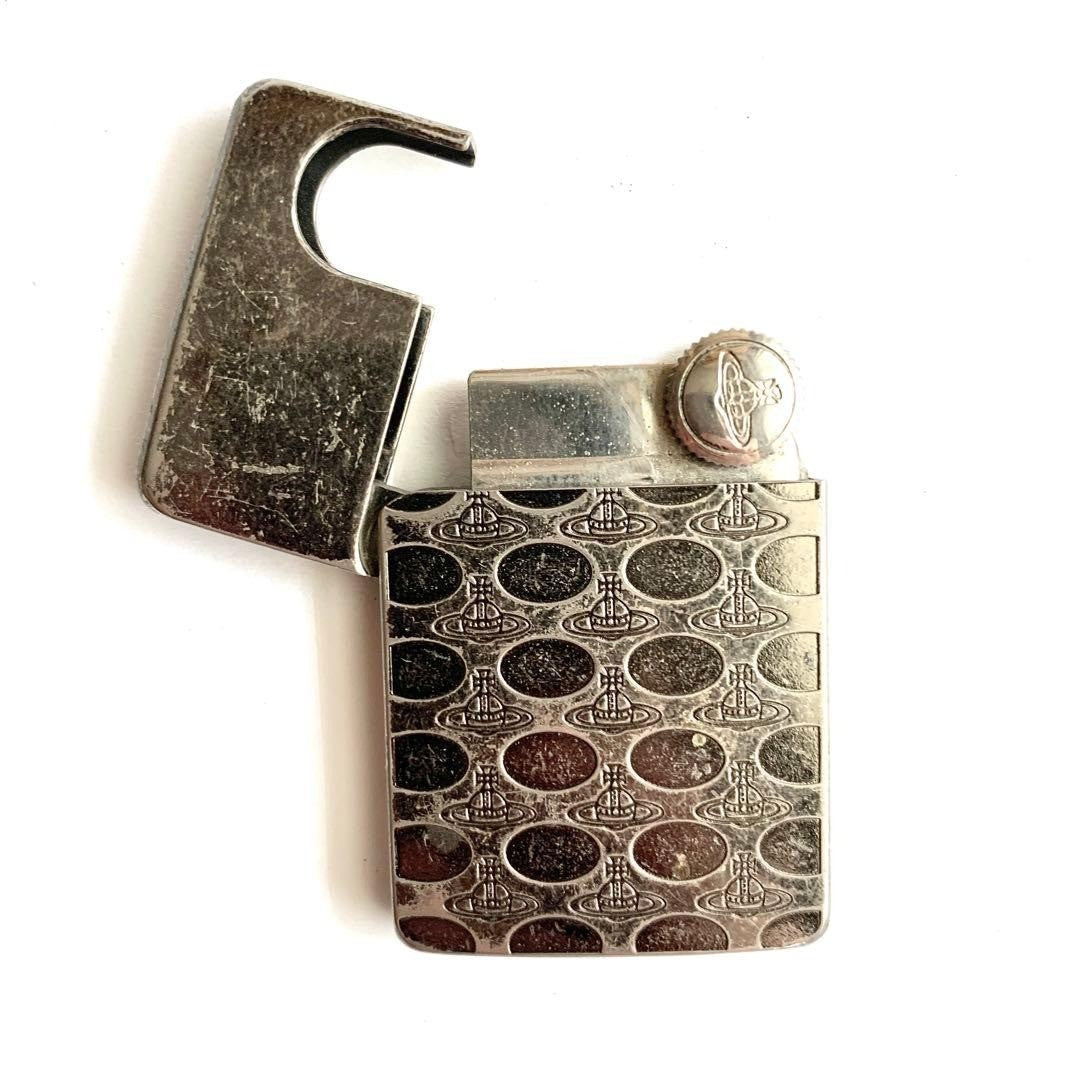 Vivie[Used] Vivienne Westwood Gas Lighter Orb Silver patterned all over no flint