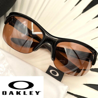 Oakley Commit Sunglasses 03-786 62/12 124 Black Frame Brown Lenses