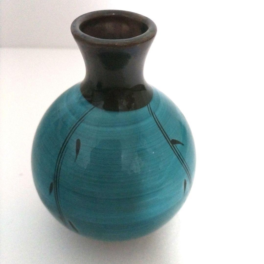 Turquoise blue ceramic sake set. One sake bottle, three tea cups.