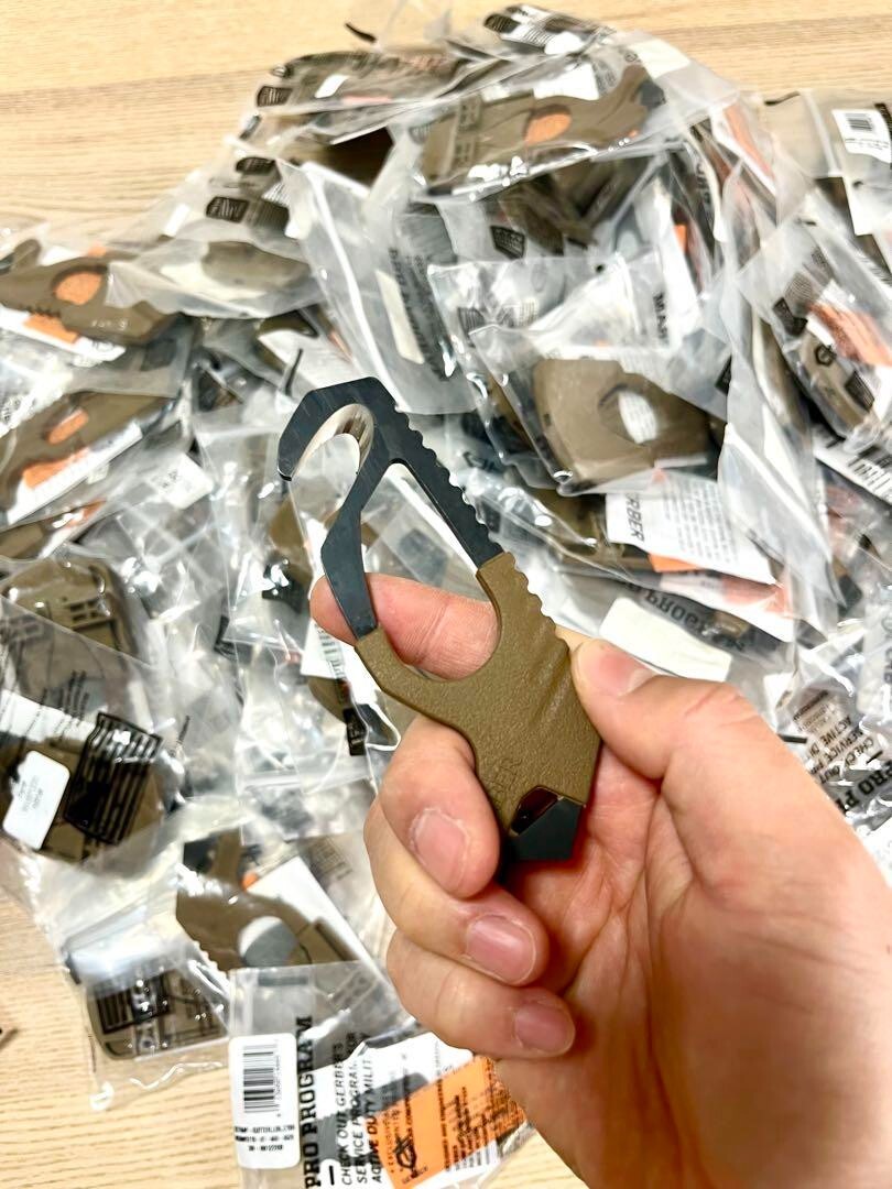 U.S. military release, new and unused GERBER strap cutter glass breaker